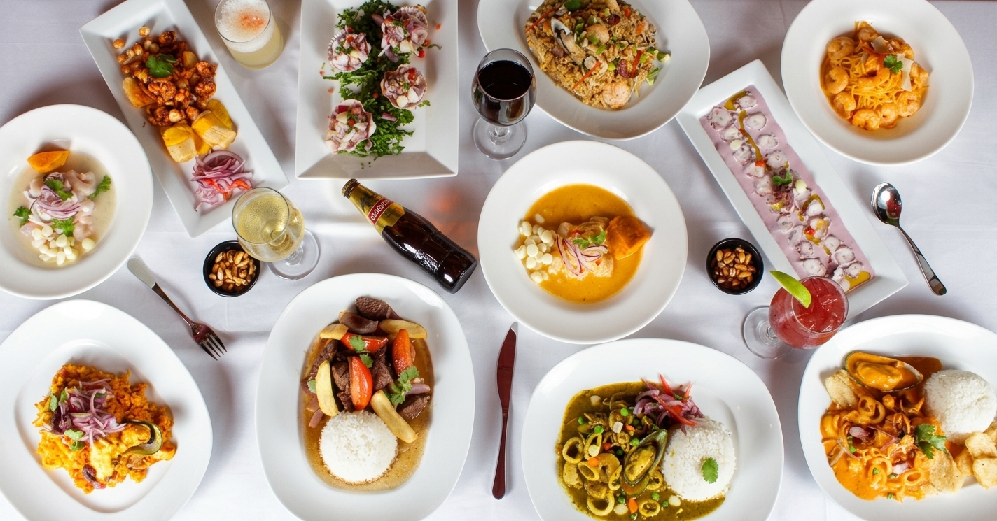 Guests gathered around a table set with Peruvian dishes at a Ceviche 595 private event